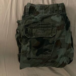 Camo jeans, tight boot cut. Missing a button